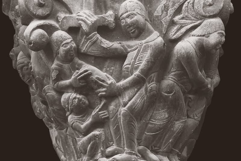 Saint Lawrence handing over the Holy Chalice, in a capital of the Lonja Chica of Jaca Cathedral 12th century